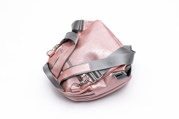 Fashion women leather pink backpack isolated on a white background.