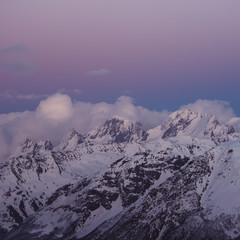 Snowy mountain peaks beautiful landscape at sunset