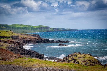Beautiful volcanic rock and crashing waves along the coast of Maui Hawaii