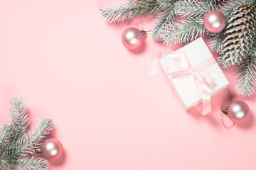 Christmas flat lay background with christmas present box on pink.