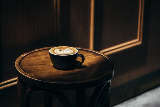 Coffee with latte art on a chair