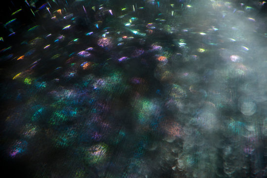 Colorful holographic silver liquid close up