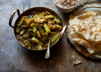 Spicy mixed seafood curry with brown rice and chickpea poppadoms