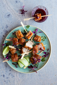 Pork skewers with plum dipping sauce