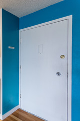White front door and blue walls