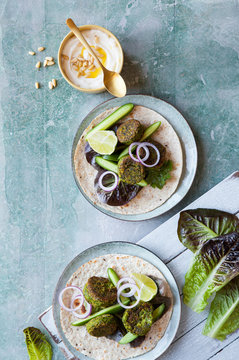 Spinach falafel wrap with cucumber and lettace