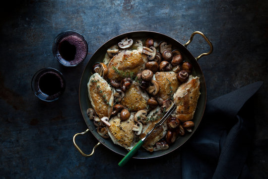 Roasted chicken with mushrooms and herb garnish