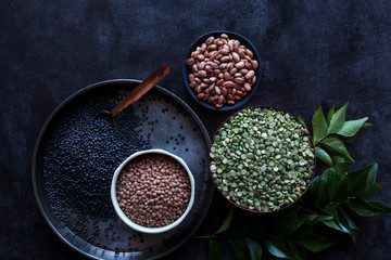 A variety of pulses and curry leaves
