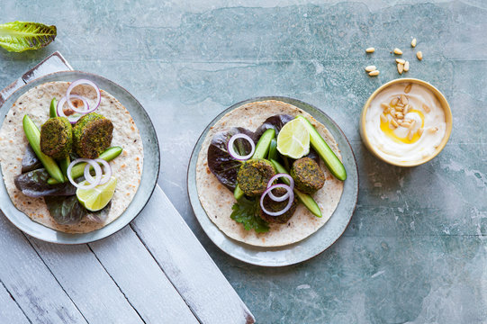 Spinach falafel wrap with cucumber and lettace