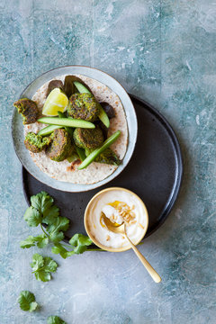 Spinach falafel wrap with cucumber and lettace