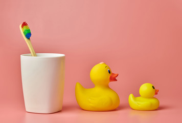 Eco bamboo toothbrush and duck toys. Personal care tool for protect oral cavity, remove plaque and...