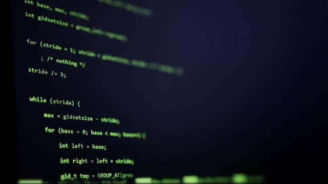Close up coding and programming on screen. Hacker computer screen. Computer hacker typing code on keyboard late night working.