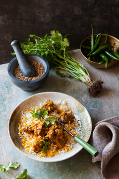 Biryani chicken curry with rice and ingredients