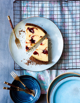Chocolate base cheesecake decorated with raspberry jam