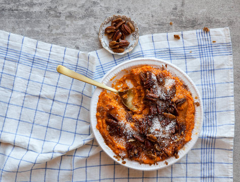 Potato pumpkin squash casserole topped with toasted pecan nut and coconut