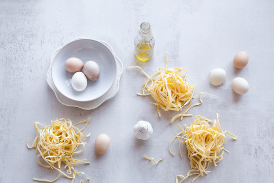 Bundles of raw homemade fettuccini pasta