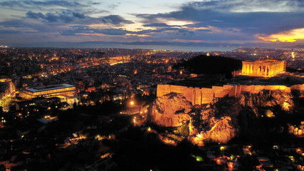 Naklejka premium Aerial drone photo of illuminated Acropolis hill and Masterpiece Parthenon with beautiful colours at dusk, Athens, Attica, Greece