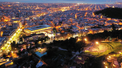 Aerial drone photo of Athens new modern Acropolis museum and urban cityscape at dusk with beautiful colours and cloudy sky, Attica, Greece
