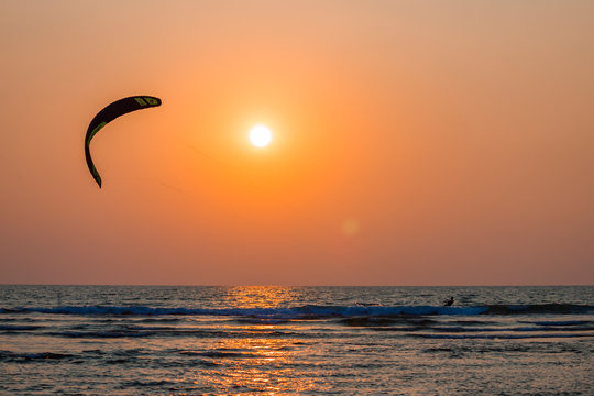 Kitesurfer at sunset near the Arambol beach in GOA