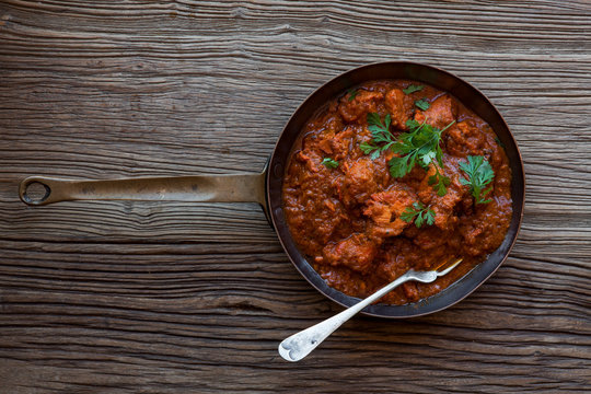 Indian Curry Dish Chicken Tikka Masala garnished with cilantro or also known as coriander