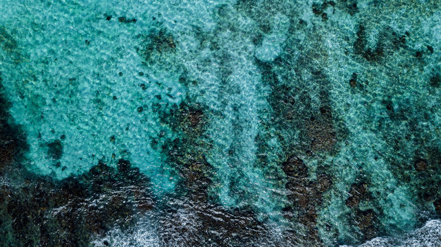 Drone View Of A Tropical Beach - coral reef with transparent water