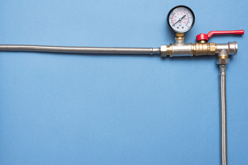 Plumbing flat lay background with copy space. Work tools and pipeline parts on plumber workbench.