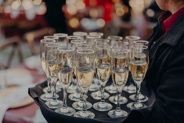 Champagne glasses with alcoholic beverage