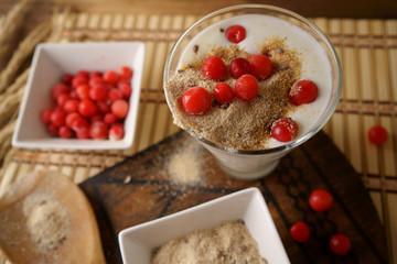 Yogurt with sprouted wheat and cherry. 