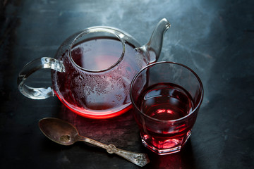Cranberry and Pomegranate herbal tea in teapot and glass