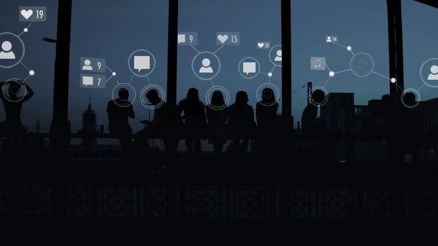 Sillhouettes of a group of young people who use social media - Digital animated graphs, messages, contacs, chatting