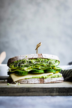 A healthy cheese and green salad sandwich on brown bread, with cucumber and cress.