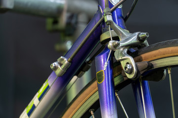 Grodno, Belarus, February 14, 2019: Repair road bike. Photo in the Studio on a black background. Restoration of an old racing bike. Broken parts close up.