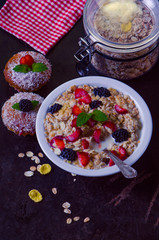 granola with milk fruit and muffins