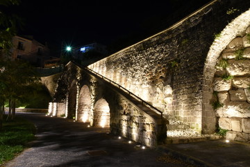 Fototapeta premium Caiazzo, Italy, 11/12/2019. Night view of a stairway in a medieval village