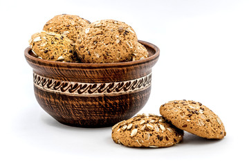 Clay plate with cookies on white isolated background_