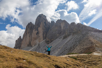 Fototapeta premium Female photographer on a trek around Tre Cime in the Italian Dolomites