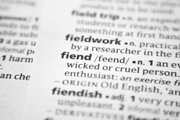 Fototapeta premium Word or phrase Fiend in a dictionary.