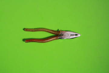 old pliers in color background