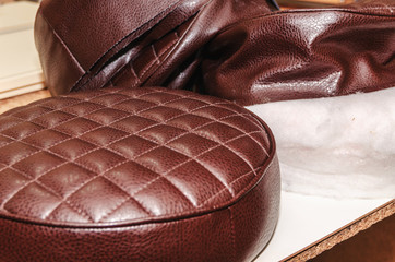 Obraz premium Seat upholstery in a furniture workshop, eco-leather cover