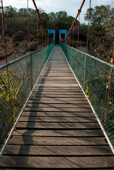 Naklejka premium bridge of the Park of the Sun, one of the main attractions of Tonatico, Mexican Town