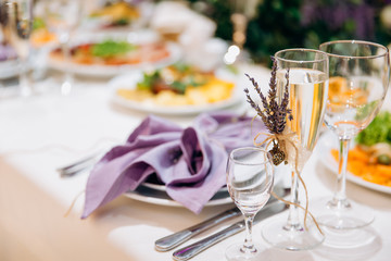 Two wedding champagne glasses decorated lavender. Love