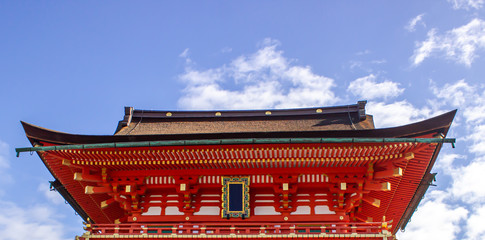 A beautiful red temple against the blue sky in Japan