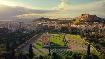Aerial drone photo of iconic ruins of Temple of Olympian Zeus next to world famous Acropolis hill and the Parthenon, Athens, Attica, Greece