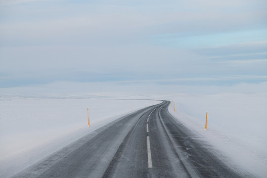 Beautiful winter road with white snow around. Road trip in Iceland