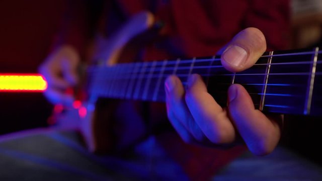 Close up of musician playing electric guitar