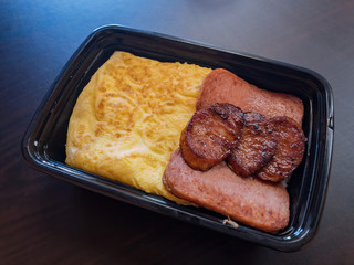 Close up shot of a box of spam and fried egg