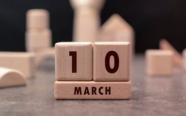 March 10 written with wooden blocks