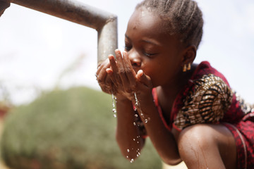 Health and Hygiene symbol, Black Young Girl Drinking Fresh Clean Water from Tap