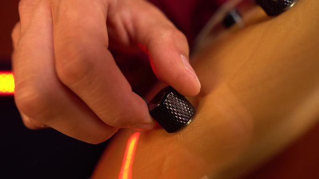 Close up of musician hand tunning guitar