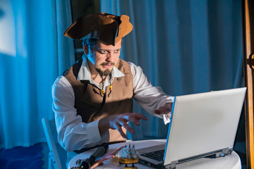 a computer pirate sitting at the laptop funny concept of digital security